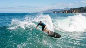 Surfing Magazine | PDR – Destinations, Gear & Technique Guides 2 Stand up paddle surfer carving clean bottom turn on peeling turquoise ocean wave